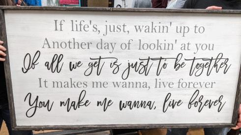 Oversized sign - If life's, just, wakin' up to another day of lookin' at you